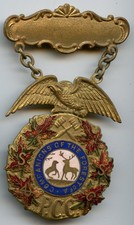 Antique Companions of the Forest of America Fraternal Society Brooch with Celluloid Elk Medallion and Devotional Charms