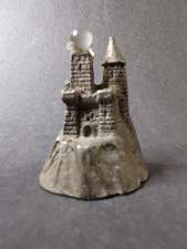 Pewter Castle/Tower Figurine with Faceted Crystal Point Spire Yes - there is text/logo on the bottom — listing 4