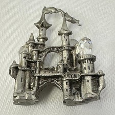 Pewter Castle/Tower Figurine with Faceted Crystal Point Spire Yes - there is text/logo on the bottom — listing 5