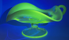 Vaseline / Uranium Glass Nappy Dish with Blue Opalescent Ruffled Rim and Applied Handle — listing 4