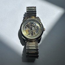 Black-Tone Skeleton Automatic Wristwatch with Gold Movement and Tachymeter Bezel