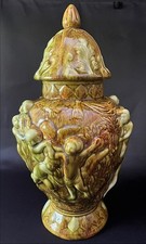 Pair of Italian Capodimonte-Style Covered Urns with Figural Cherub Finials and Relief Putti Scenes — listing 4