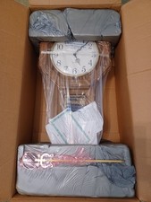 Howard Miller Westminster Chime Wall Clock with Broken-Arch Pediment and Urn Finial Key-wound mechanical