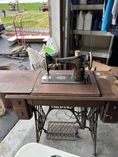 Singer Model 66 Treadle Sewing Machine with Red Eye Decals in Oak Cabinet — listing 5