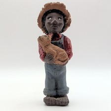 Resin Figurine of Seated African American Girl Holding Baby Doll — listing 2