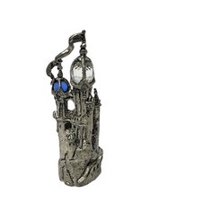 Pewter Castle/Tower Figurine with Faceted Crystal Point Spire Yes - there is text/logo on the bottom — listing 2