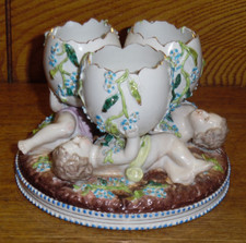 German Porcelain Cherub Figural Cornucopia Vase with Applied Flowers