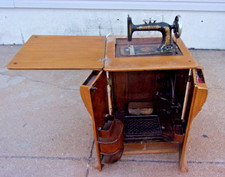 Antique Treadle Sewing Machine in Ornate Cast-Iron and Oak Cabinet — listing 3