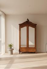 Antique Hand-Carved Two-Door Armoire with Foliate Scrollwork and Bird Motif