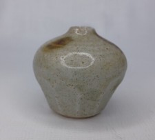 Takahashi Japanese pottery Vintage Takahashi Speckled Stoneware Sake Bottle Vase with Woven Rattan Medallion — listing 5