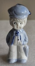 Vintage Figural Dutch Boy Ceramic Planter with Green Leaf Base
