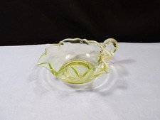 Vaseline / Uranium Glass Nappy Dish with Blue Opalescent Ruffled Rim and Applied Handle — listing 6