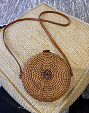 Round Woven Rattan Crossbody Bag with Floral Lining and Button-Loop Closure