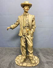 Ceramic Figurine of a Seated Barefoot Man Holding an Apple — listing 4