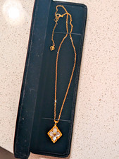 Gold-Tone Oval Pendant Necklace with Openwork Wavy Wire Design
