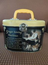 Mixed lot of vintage storage items on wooden vanity/dresser - decorative tins, sewing baskets, storage boxes, and knitting needles